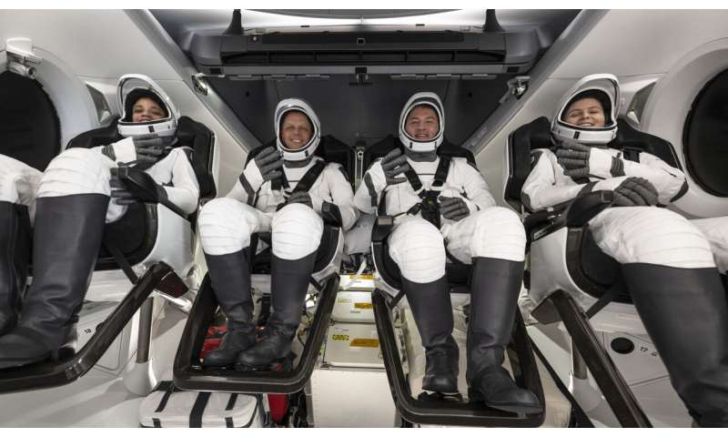 SpaceX ferries astronauts back to Earth after half-year away
